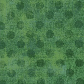 Spinatgrüne Punkte auf Grasgrün gefleckt